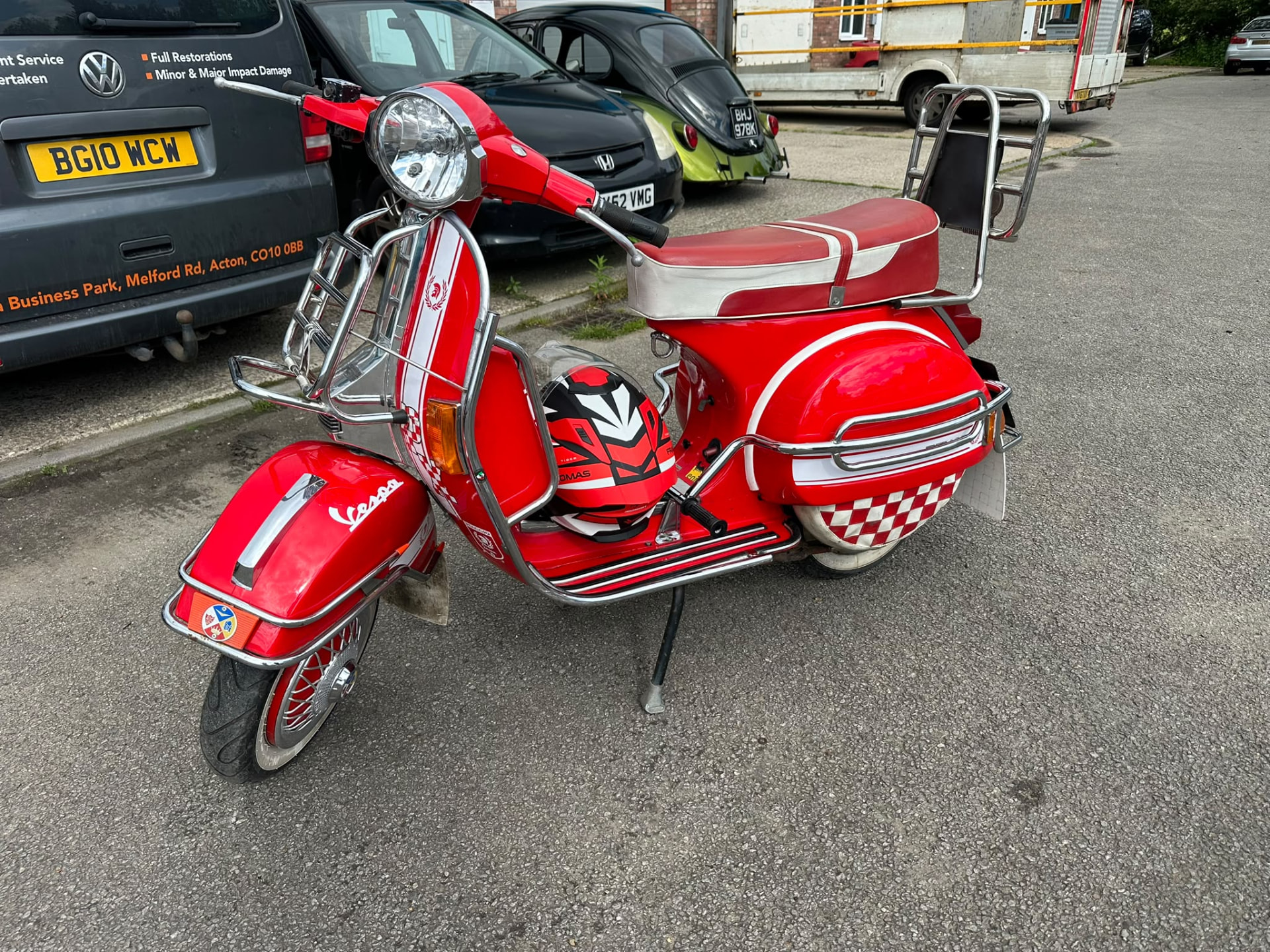 Red and white Vespa scooter refinished by Albie's